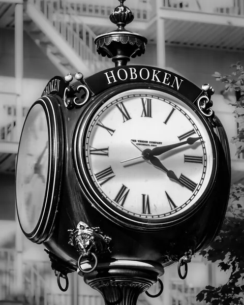 The ornate Hoboken street clock in black and white